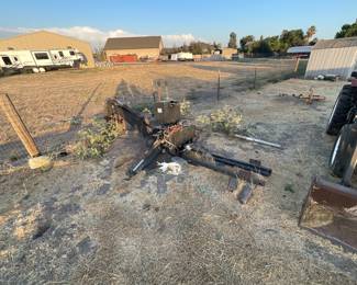 Jinma back-hoe implement and post hole auger background.