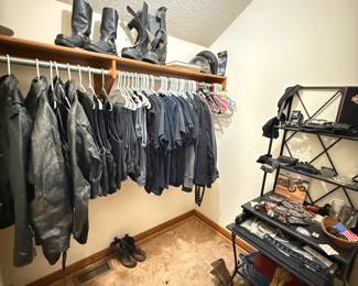 Includes leather jackets, Harley-Davidson shirts, boots, belts, gloves, helmets, and riding gear. Also features patches, pins, and small Harley-themed accessories on display shelves. 
Bull riding rope, cowboy boots and cowboy hat