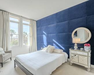 Bed, nightstand, and chair.