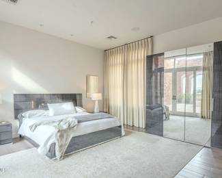 Blue-gray bedroom set with matching wardrobe, (x2), nightstands, lamps and area rug.