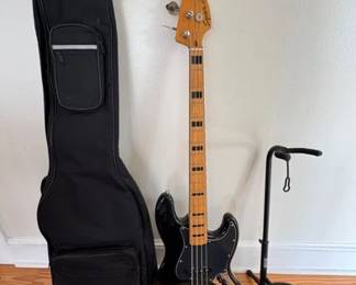 Fender jazz bass guitar, case, stand and wall mount holder