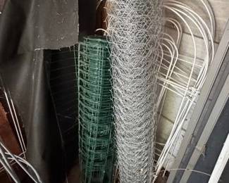 Plant cages, wire rolls, and garden edging pieces