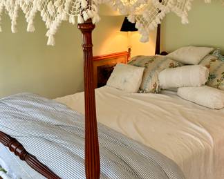 Antique four poster canopy bed with handmade lace draping