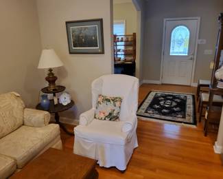 Slip Covered Wing Chair with a Floral Fabric Underneath