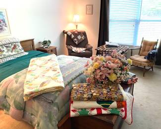 Bed and quilts.