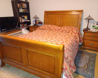 Queen bedroom suite with bed, nightstands and large dresser