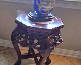 carved plant stand with Russian egg