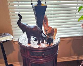 round side table with Tiffany style lamp and elephants