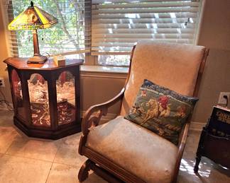 cozy reading nook with vintage chair and display cabinet
