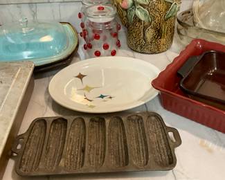 Kitchen - cornbread stick, pan, platter & covered turquoise bowls in very back