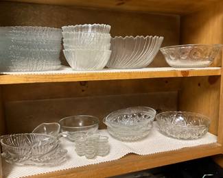 Kitchen - upper shelf I’d plates, bowls, large bowl, smaller bowl; second shelf - more bowls!