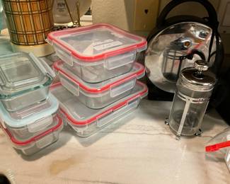 Kitchen - closeup of storage containers, aluminum & glass holder, kettle in back