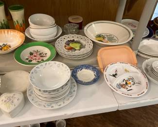 Kitchen - bowls, divided Disney platter, white bowl set in back at top, orange bowl to left at top, heart shaped container, fruit lace edged plates
