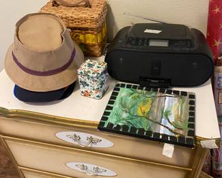 Master bedroom - 3 drawer painted chest, hats, caps, straw carrier, radio with speakers, tin, painting 