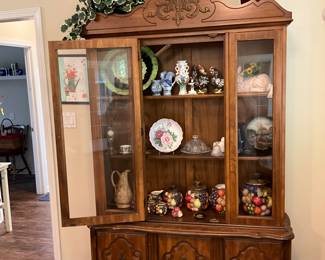 Kitchen - China Cabinet full of items along with decor on top