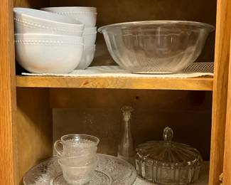 Kitchen - platter & cups, covered glass candy dis & oil/vinegar with lid + bowls on top shelf with large pyrex bowl on right