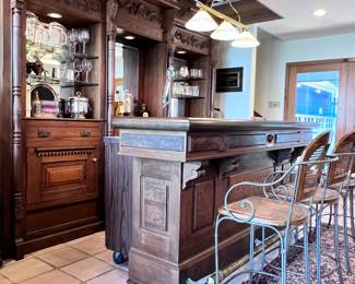 Home Bar! Ornate Victorian-Style Carved Wood. Front Bar with Brass Foot Rest. Back Bar with Lighted Compartments, Glass Shelves, Drawers and Cupboards.