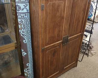 Armoire. New outdoor rug.