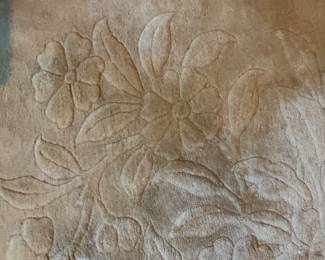 Detail of gold wool carpeting
