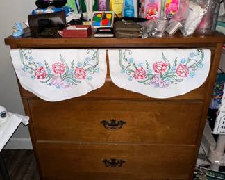 Chest of Drawers; Embroidered Table Scarves; Shampoo; Conditioner; Lotion; Nail Clippers; Iron; Wallets; Serenity Tena Disp. Underwear; Sunglasses