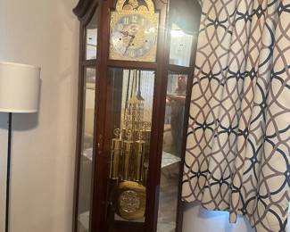Lighted Howard Miller Grandfather Clock with Curio Cabinet Model 610-841