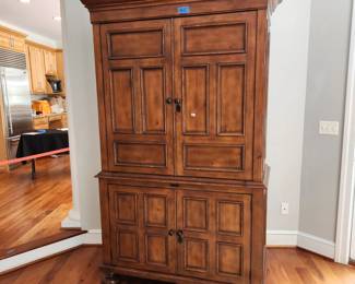 Armoire/TV cabinet. NOTE: has a couple small dog chew spots on base trim. $50.00. (I think it would make a great bar)