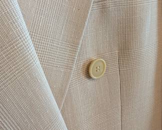 Closeup of men's vintage Ted Lapidus Paris Diffusion double-breasted blazer, light tan plaid