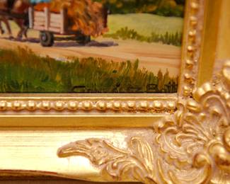 Closeup of vintage signed oil painting of rural scene – a horse-drawn hay wagon or cart laden with harvest, driven by farm worker along a country road, with foothills and mountains in the distance