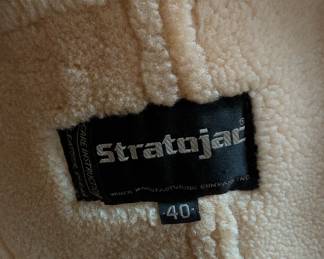 Closeup of vintage Stratojac shearling fur lined distressed leather jacket, mens Size 40/ M, Tan