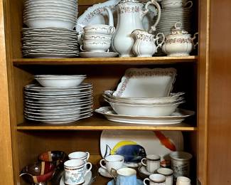 Vintage set of china including coffee pot, sugar, creamer, plates, bowls, cups and saucers, platter, and serving dishes