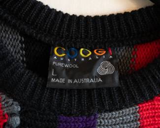 Closeup of a vintage Coogi Australia 100% wool knit sweater, crew neck, multi-color stripes, size L