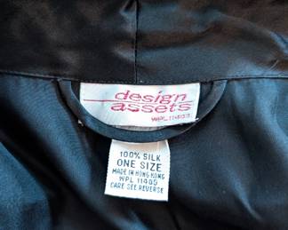 Closeup of Design Assets black silk belted robe