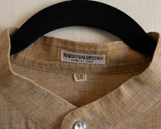 Closeup of Mario Valentino men's light brown long-sleeved shirt with mandarin collar, button-down front and two chest pockets. Size 50, Made in Italy.