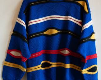 A vintage Coogi Australia 100% wool knit pullover sweater, blue with colorful horizontal stripes, size L