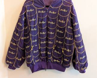A one-of-a-kind treasure for Crown Royal enthusiasts: A zip front and lined jacket hand-crafted from Crown Royal bags. Note how the two front pockets are decorated with the gold drawstring cord!