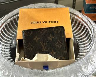 A Louis Vuitton leather wallet in original box, shown inside a stunning Lalique Crystal Marguerites bowl