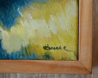 Closeup of signature on signed oil on canvas painting of brightly colored vintage trucks