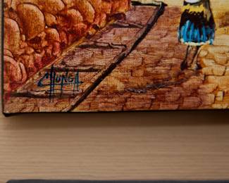 Closeup of signature on pair of signed paintings of Peruvian street scenes