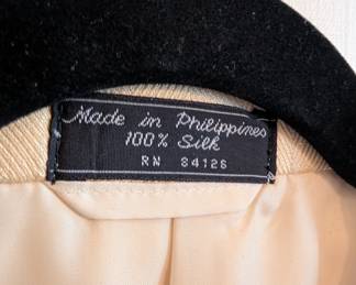 Closeup of men's vintage Egon von Fürstenberg 100% silk cream colored blazer