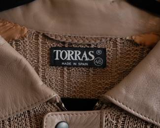 Closeup of Torras men's light brown leather and knit long sleeve sweater, size 46, made in Spain