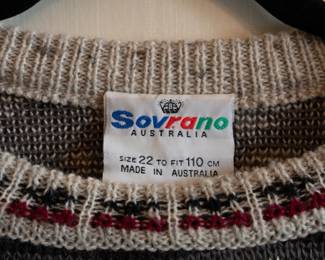 Closeup of vintage men's Sovrano Australia textured knit sweater, pullover with crew neck, size 22