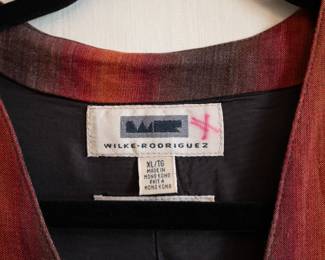 Closeup of vintage men's red and brown shaded striped vest by Wilke-Rodriguez size XL