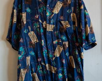 Vintage Robert Stock men's silk short-sleeve button front shirt, dark blue with retro "travel" print pattern of luggage labels and hotel signs