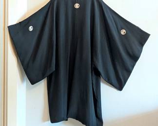 Back view of a vintage Japanese men's black silk Montsuki Five Family Crest formal kimono