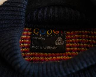 Closeup of a vintage Coogi Australia 100% wool knit sweater, mock turtleneck, multi-color patterned, size L