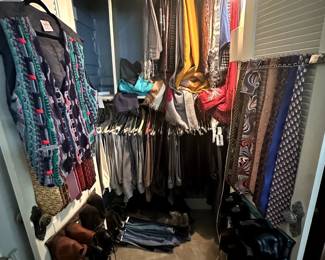 One closet full showing designer men's pants, ties, scarves, and a Cuggi vest!
