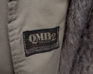 Closeup of QMB2 opossum fur lined raincoat - double breasted coat with inner fur lining and fur shawl collar