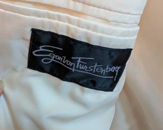 Closeup of men's vintage Egon von Fürstenberg 100% silk cream colored blazer