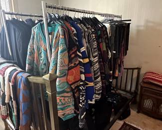 Racks and racks of 1980's to contemporary men's clothing including multiple Coogi and Cuggi sweaters!