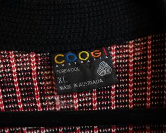 Closeup of a vintage Coogi 100% wool cardigan knit sweater, size XL